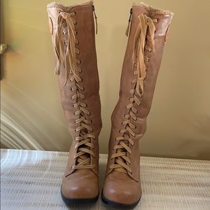 Woman’s light brown lace up wedge boots